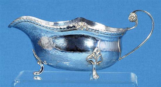 A George V Arts & Crafts silver sauce boat, by Albert Edward Jones, length 185mm, weight 7.3oz/228grms.